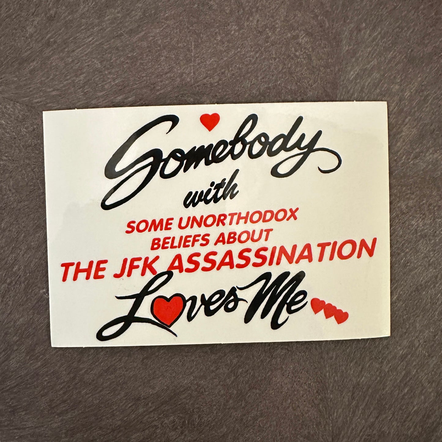 Somebody with Some Unorthodox Beliefs About the JFK Assassination Loves Me Sticker